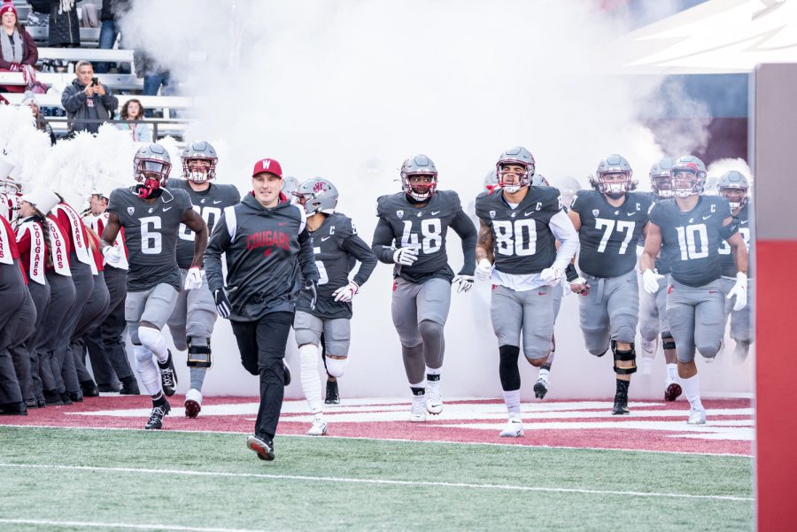 The WSU football team runs out onto the field before an NCAA football game against Arizona State