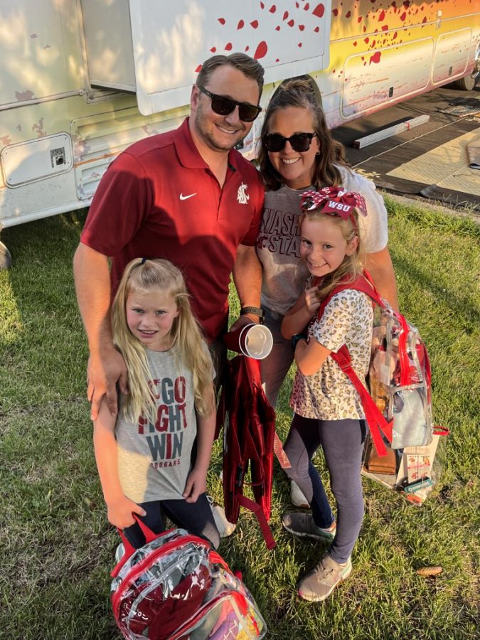 Alex and Sara Hill with their two daughters at a WSU football game. 