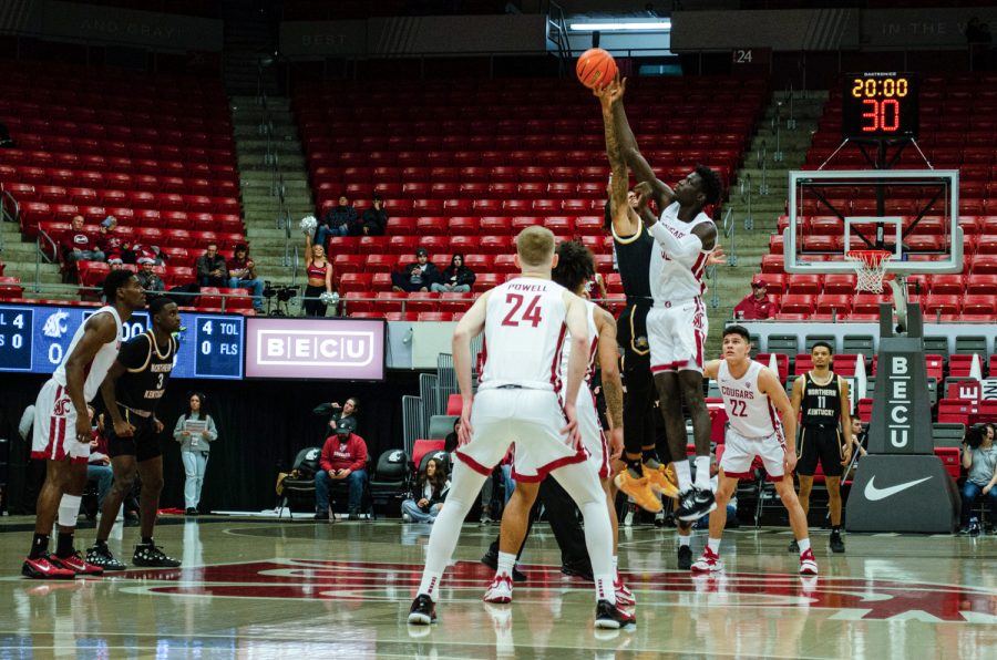 WSU+forward+Mouhamed+Gueye+reaches+for+the+ball+during+the+tip-off+of+an+NCAA+mens+basketball+game+against+Northern+Kentucky%2C+Dec.+7.