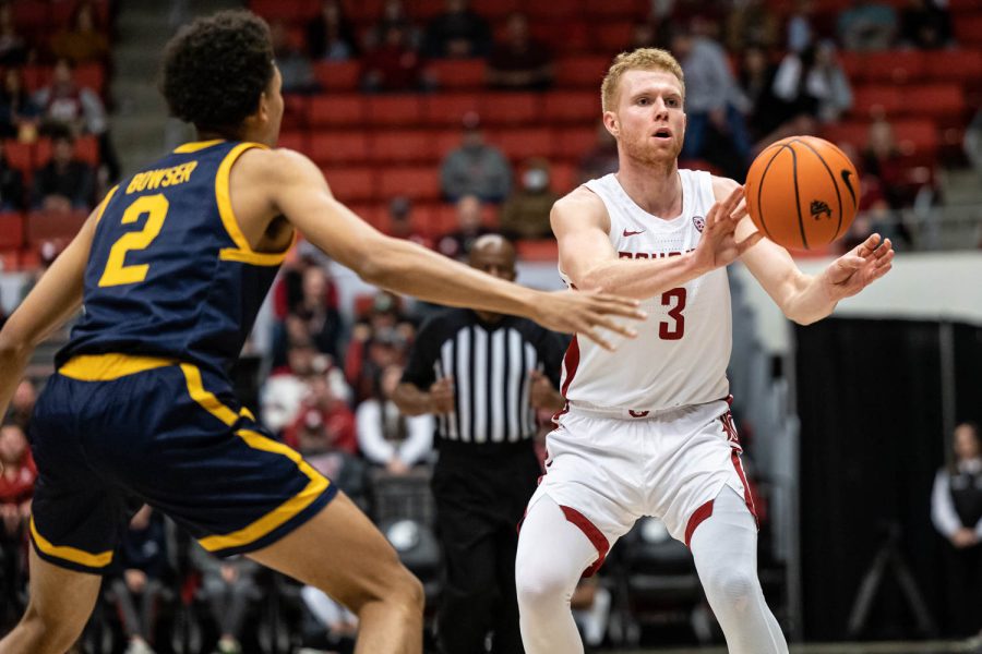 WSU guard Jabe Mullins passes the ball during an NCAA basketball game against California, Jan. 11.