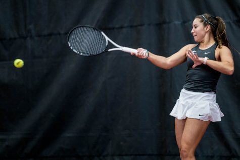 WSU tennis player Eva Alvarez Sande hits the ball during an NCAA match against Montana, Jan, 13.