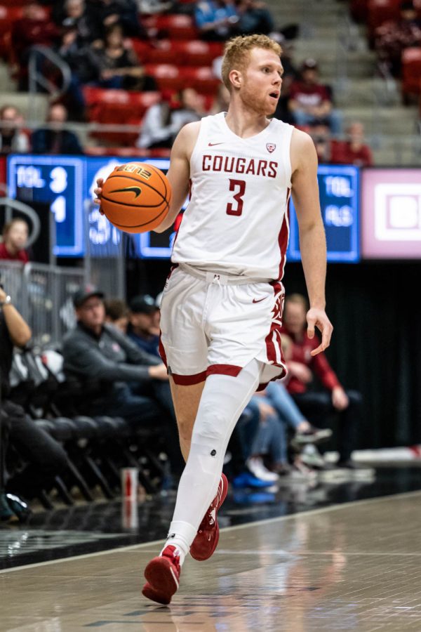 WSU guard Jabe Mullins dribbles the ball during an NCAA basketball game against Stanford, Jan. 14.