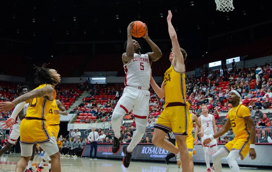 WSU guard TJ Bamba attempts to shoot the ball during an NCAA men’s basketball game against ASU, Jan 28.