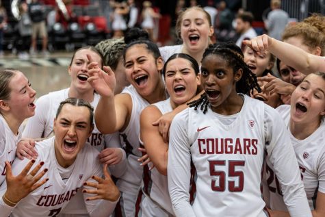 The WSU women’s basketball team sings “Man! I Feel Like A Woman” by Shania Twain while celebrating a 67-57 victory over Oregon State, Feb. 19, 2023, in Pullman, Wash.