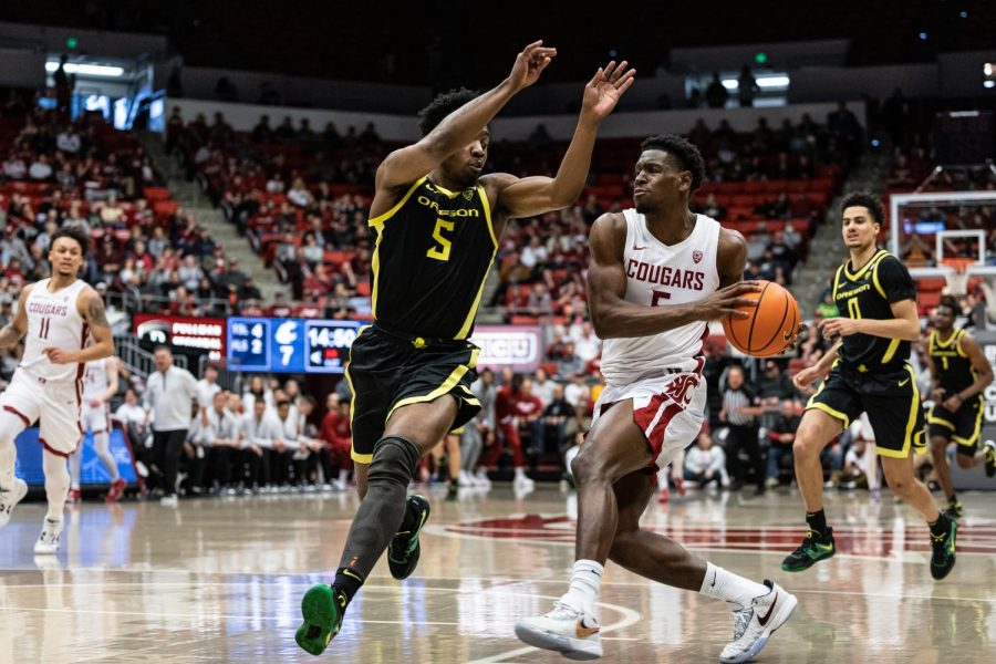 WSU guard TJ Bamba drives to the hoop during an NCAA basketball game against Oregon, Feb. 19, 2023, in Pullman, Wash.