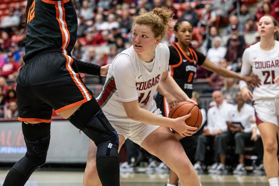 WSU center Jessica Clarke looks for a pass during an NCAA basketball game against Oregon State, Feb. 19, 2023, in Pullman, Wash.