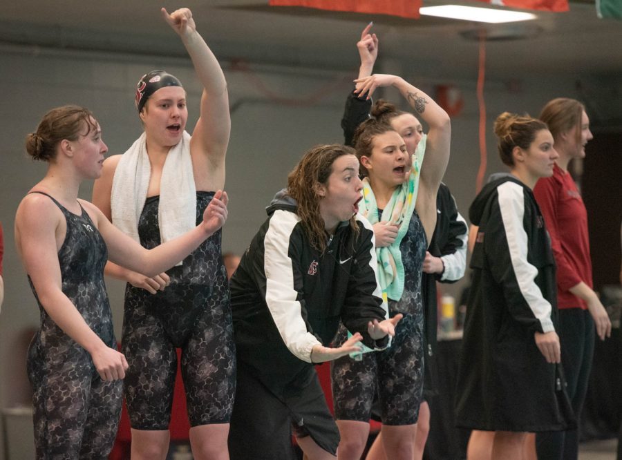 WSU women’s swim team encourages their teammates during an NCAA women’s swim meet against University of Idaho, Feb 3. 