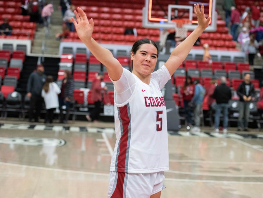 WSU guard Charlisse Leger-Walker waves goodbye to the fans after an NCAA basketball game against Cal, Sunday, Feb. 5, 2023, in Pullman, Wash.