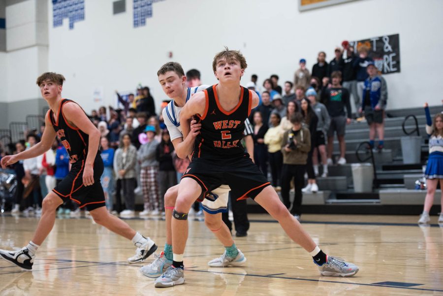 West Valley player Parker Munns boxes out against Pullman point guard Jaedyn Brown  during the 2A district championship basketball game against West Valley on Thursday, Feb.16, 2023, in Pullman, Wash.