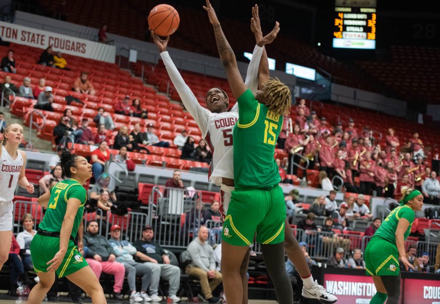 WSU center Bella Murekatete goes up for a shot against Oregon center Phillipina Kyei during an NCAA women’s basketball game against Oregon, Friday, Feb. 17, 2023, in Pullman, Wash.