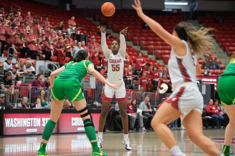 WSU center Bella Murekatete passes the ball to WSU guard Charlisse Leger-Walker during an NCAA women’s basketball game against Oregon, Friday, Feb. 17, 2023, in Pullman, Wash.