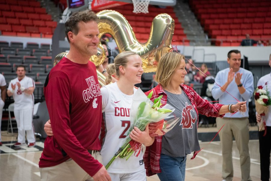 WSU guard Grace Sarver walks out with her family for senior night before an NCAA womens basketball game against Oregon State, Sunday, Feb. 19, 2023, in Pullman, Wash.