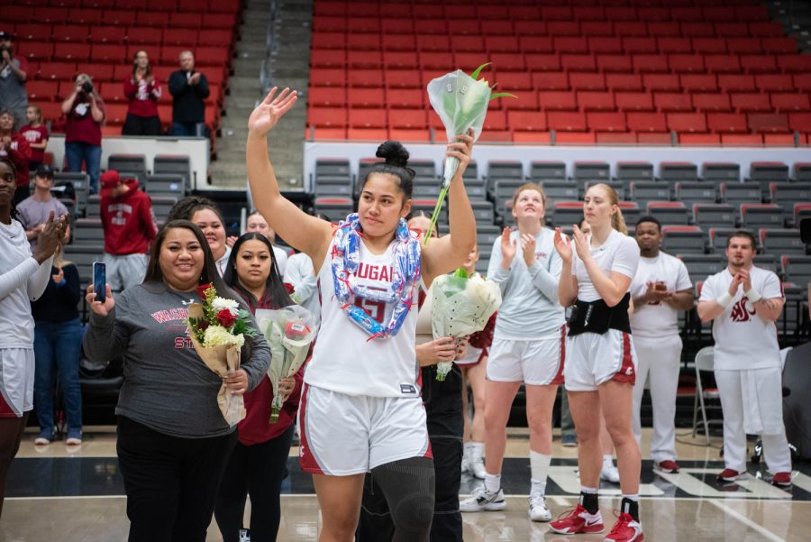 WSU forward Ula Motuga walks out with her family for senior night before an NCAA womens basketball game against Oregon State, Sunday, Feb. 19, 2023, in Pullman, Wash.
