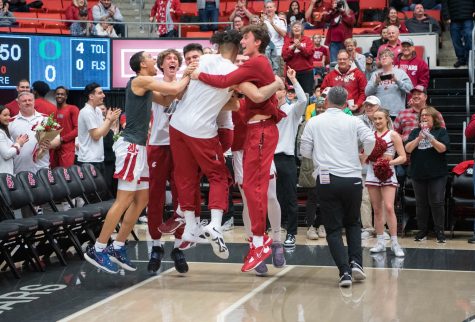 WSU men’s basketball team celebrate with WSU guard DJ Rodman after the later-rescinded announcement that Rodman would be returning to the program for his 5th year before an NCAA men’s basketball game, Feb. 19, 2023, in Pullman, Wash.