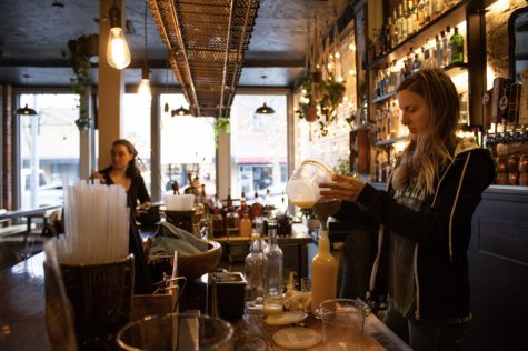 Bartender Lily Taylor cuts and juices lemons, The Black Cypress Feb. 6.