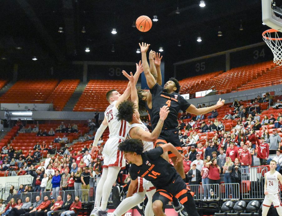 Players from both WSU and Oregon State go up for a ball during an NCAA men’s basketball game against Oregon State, Thursday, Feb.16, 2023, Pullman, Wash. 
