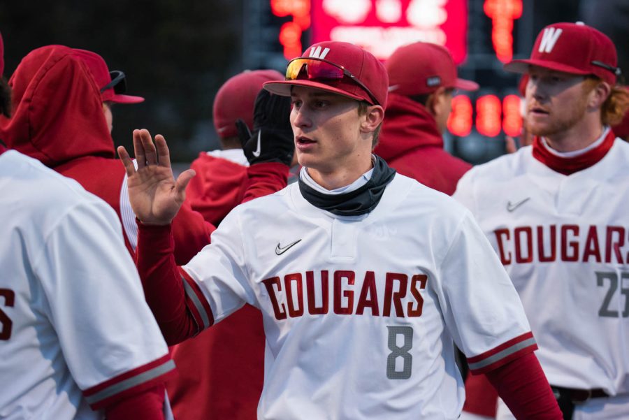 WSU+infielder+Elijah+Hainline+high-fives+his+teammates+after+winning+an+NCAA+baseball+game+against+Southern+Indiana%2C+Saturday%2C+March+4%2C+2023%2C+in+Pullman%2C+Wash.