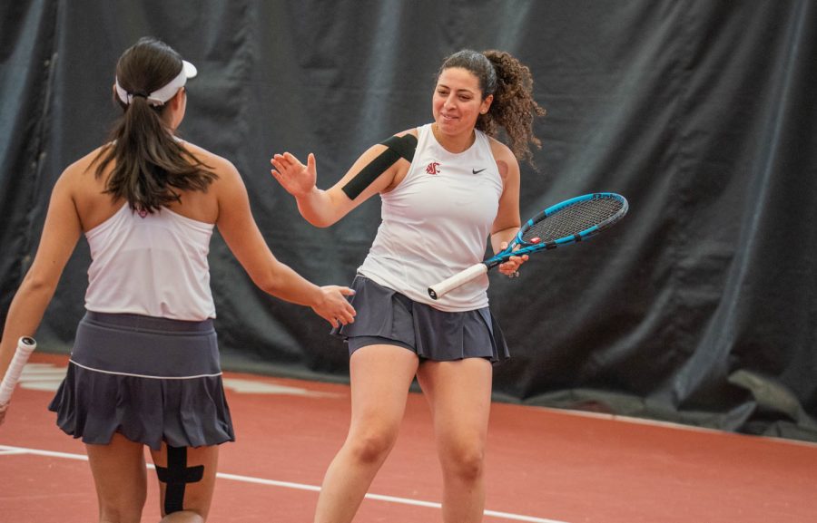 WSU tennis player Hania Abouelsaad celebrates with her partner Elyse Tse during an NCAA tennis match against UCLA, Sunday, March 5, 2023, in Pullman, Wash. 