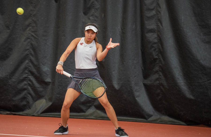 WSU tennis player Fifa Kumhom hits the ball during an NCAA tennis match against UCLA, Sunday, March 5, 2023, in Pullman, Wash. 