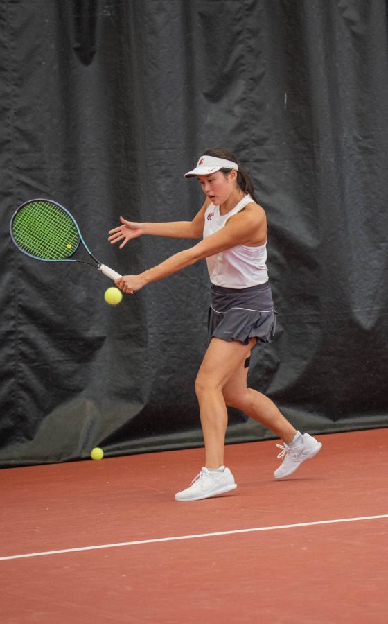 WSU tennis player Elyse Tse hits the ball during an NCAA tennis match against UCLA, Sunday, March 5, 2023, in Pullman, Wash.