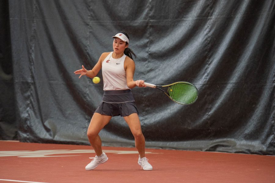 WSU tennis player Elyse Tse hits the ball during an NCAA tennis match against UCLA, Sunday, March 5, 2023, in Pullman, Wash. 