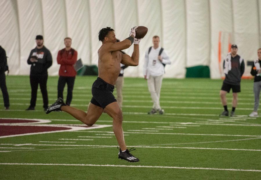 Daiyan Henley catches a ball during positional drills at the WSU 2023 Pro Day, March 28 2023, at the WSU Indoor Practice Facility.
