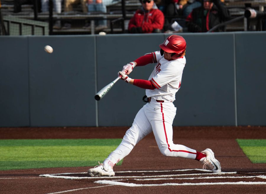WSU first baseman Sam Brown goes to hit a pitch during an NCAA baseball game against Southern Indiana, Saturday, March 4, 2023, in Pullman, Wash.