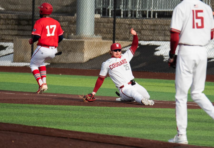 WSU first baseman Sam Brown stretches to try and get Southern Indiana infielder Daniel Lopez out during an NCAA baseball game against Southern Indiana, Saturday, March 4, 2023, in Pullman, Wash. 