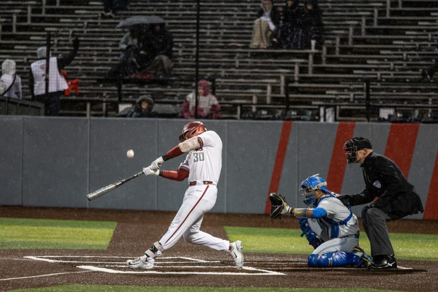 WSU catcher Will Cresswell swings at a pitch during an NCAA baseball game against UCLA, March 31, 2023, in Pullman, Wash.