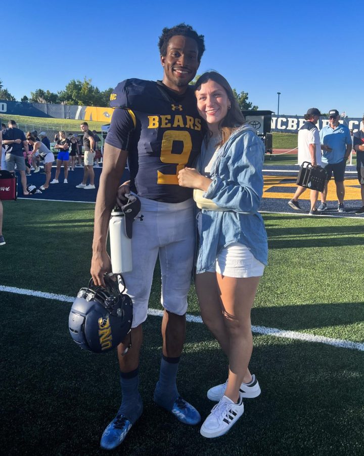 Kassidy Woods (left) and his partner Kyli Obermiller (right) at a University of Northern Colorado game.
