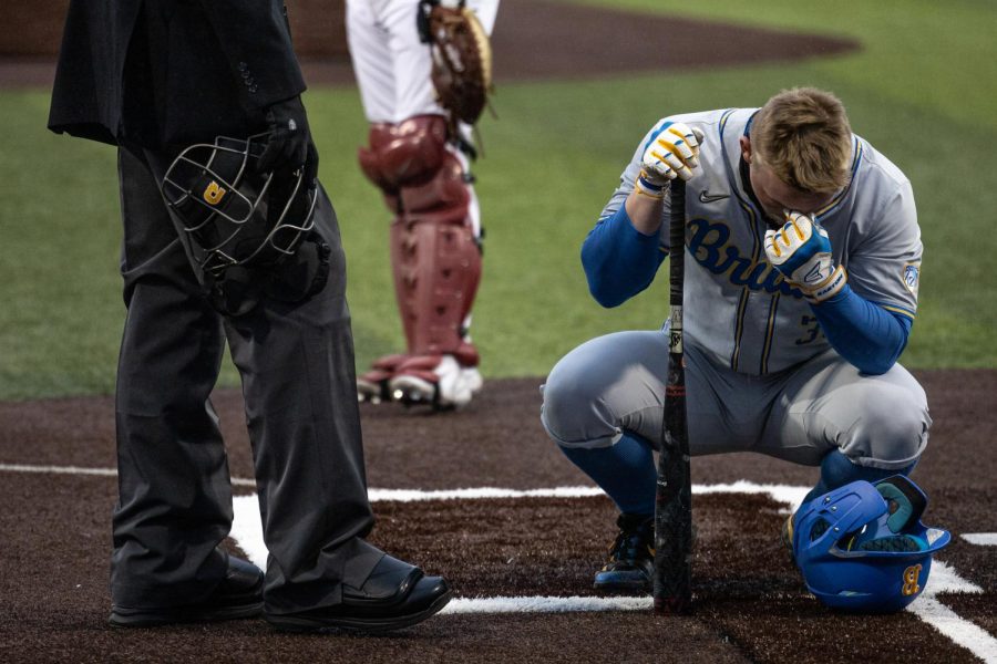 WSU pitcher Dakota Hawkins hits batter Knox Loposer in the head during an NCAA baseball game against UCLA, March 31, 2023, in Pullman, Wash.