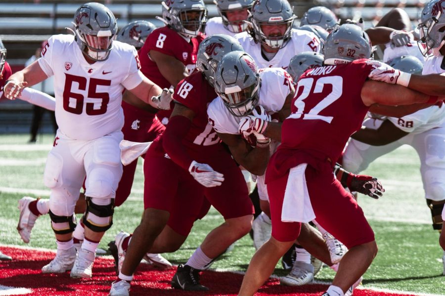 WSU running back Djouvensky Schlenbaker breaks through the defense to score a touchdown during the WSU football spring game, Saturday, April 22, 2023, in Pullman, Wash.