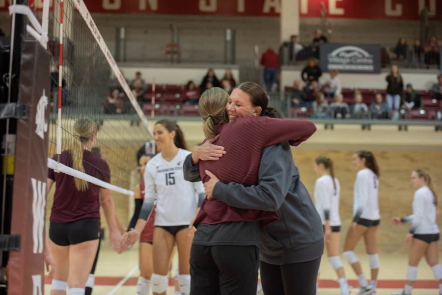 Head volleyball coach Jen Greeny embraces Montana coach following scrimmage, April 2 at Bohler Gym.
