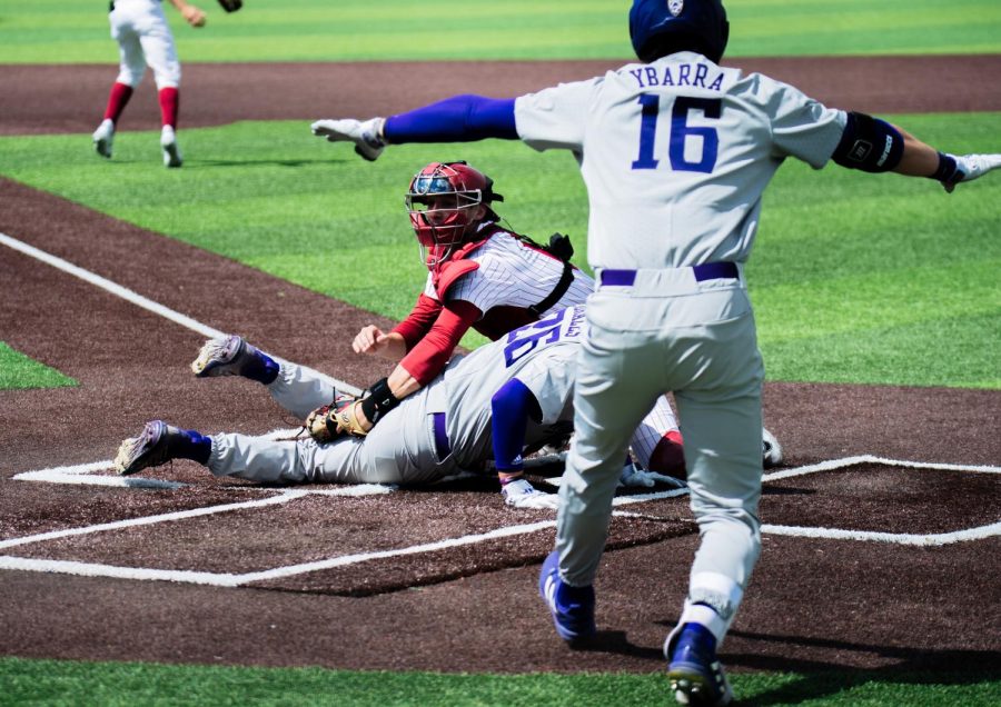 WSU catcher Jacob Morrow attempts to tag out a UW player during an NCAA baseball game against UW, Sunday, May 7th, 2023, in Pullman, Wash.
