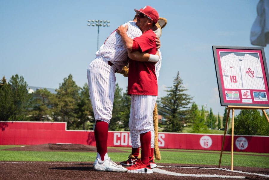 Jacob McKeon embraces his head coach during his senior night, May 20, in Pullman, Wash.