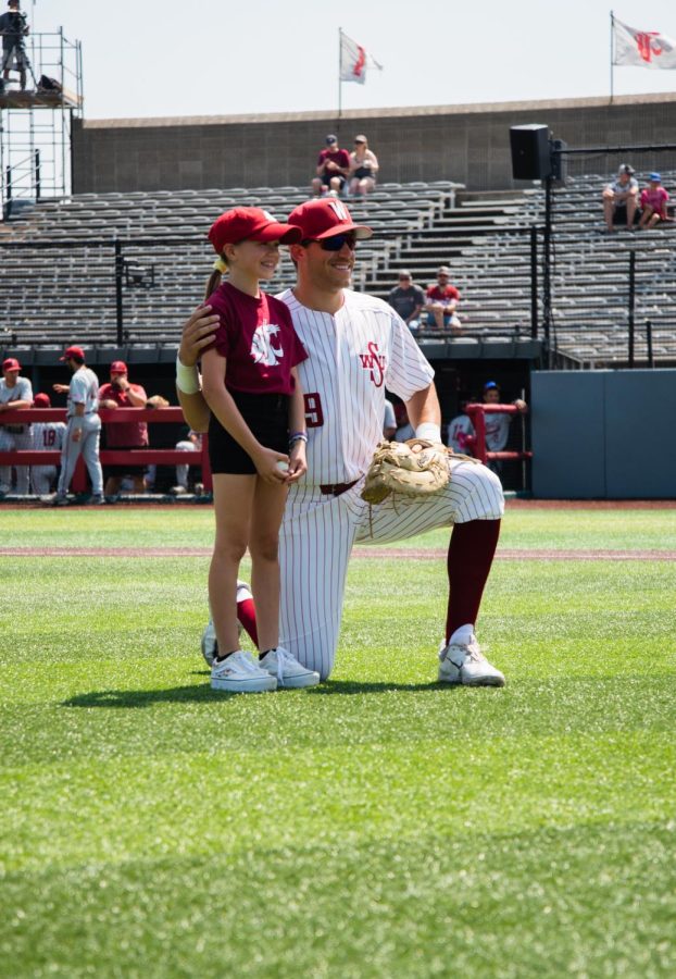 Jacob McKeon poses with his niece after she threw out the first pitch, May 20, in Pullman Wash.