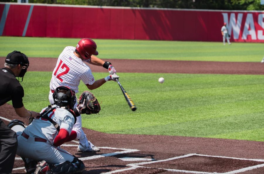 Jacob Morrow swings at a high fastball against Stanford, May 20, in Pullman, Wash.