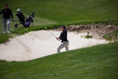 UWs Stefanie Deng hits the ball out of the sand near the hole at Palouse Ridge, May 8.