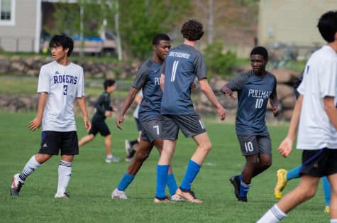 PHS players celebrate after a Clarens Dollin goal, May 8.