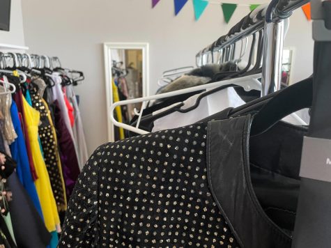 Clothing on racks at the prom pop-up shop, May 17.