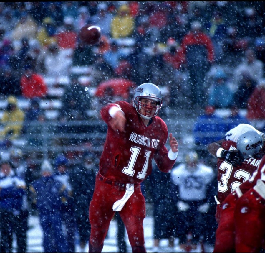 Drew Bledsoe, who became the first overall pick of the 1993 NFL Draft, throwing in the snow 