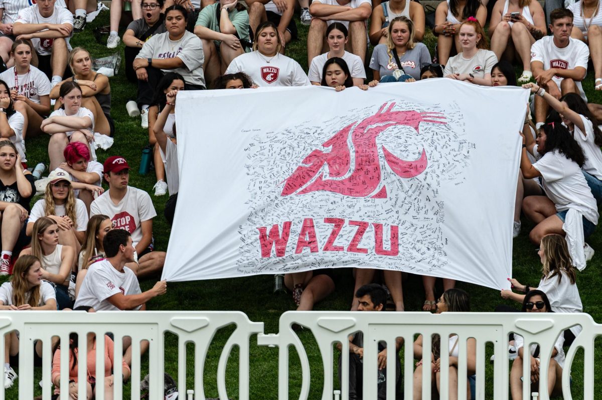 ZzuCru holds up a tifo display during an NCAA women’s soccer match against EWU, Aug. 17, 2023, in Pullman, Wash.