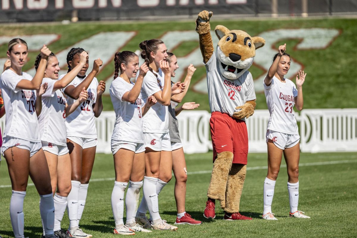 The WSU women’s soccer team celebrates with Butch T. Cougar after defeating Weber State 3-1, Aug. 27, 2023, in Pullman, Wash.