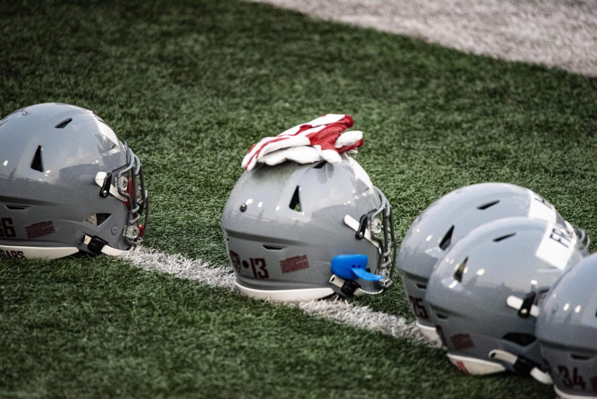 WSU defensive backs helmets waiting to be picked up prior to football scrimmage, Aug. 19, 2023, in Pullman, Wash. 