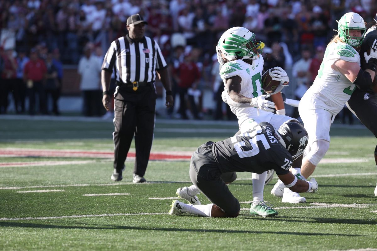Defensive Back Jaden Hicks makes a tackle  in an NCAA against Oregon in Pullman, Wash. Sept. 24, 2022 