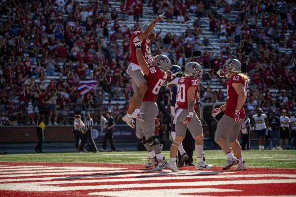 WSU receiver Lincoln Victor celebrates scoring a touchdown with lineman Maake Fifita in an NCAA football game against Northern Colorado Sept. 16, 2023 at Martin Stadium in Pullman, Wash.