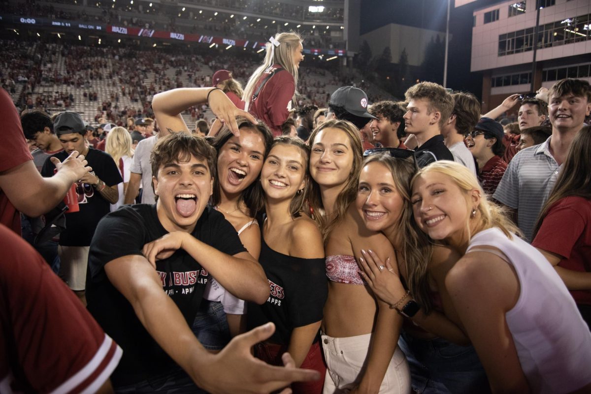 Fans rush the field and celebrate with "Back Home" and the Cougar Fight Song after win against Wisconsin, Sept. 9. 