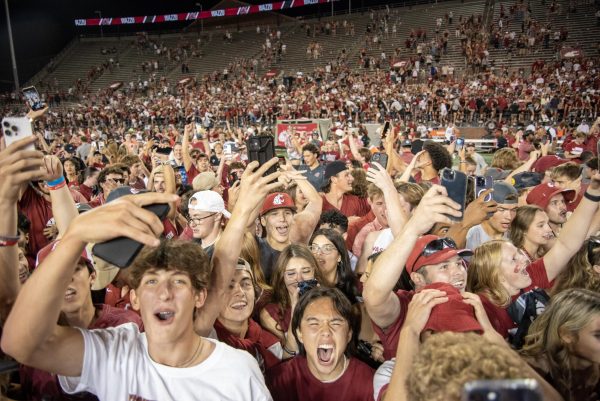 Fans rush the field and celebrate with Back Home and the Cougar Fight Song after win against Wisconsin, Sept. 9. 