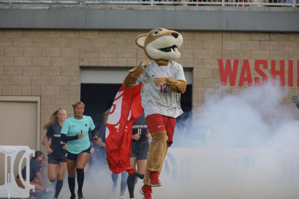 Butch and the Cougs run before a match vs. the Seattle U Redhawks Sept. 14, 2023