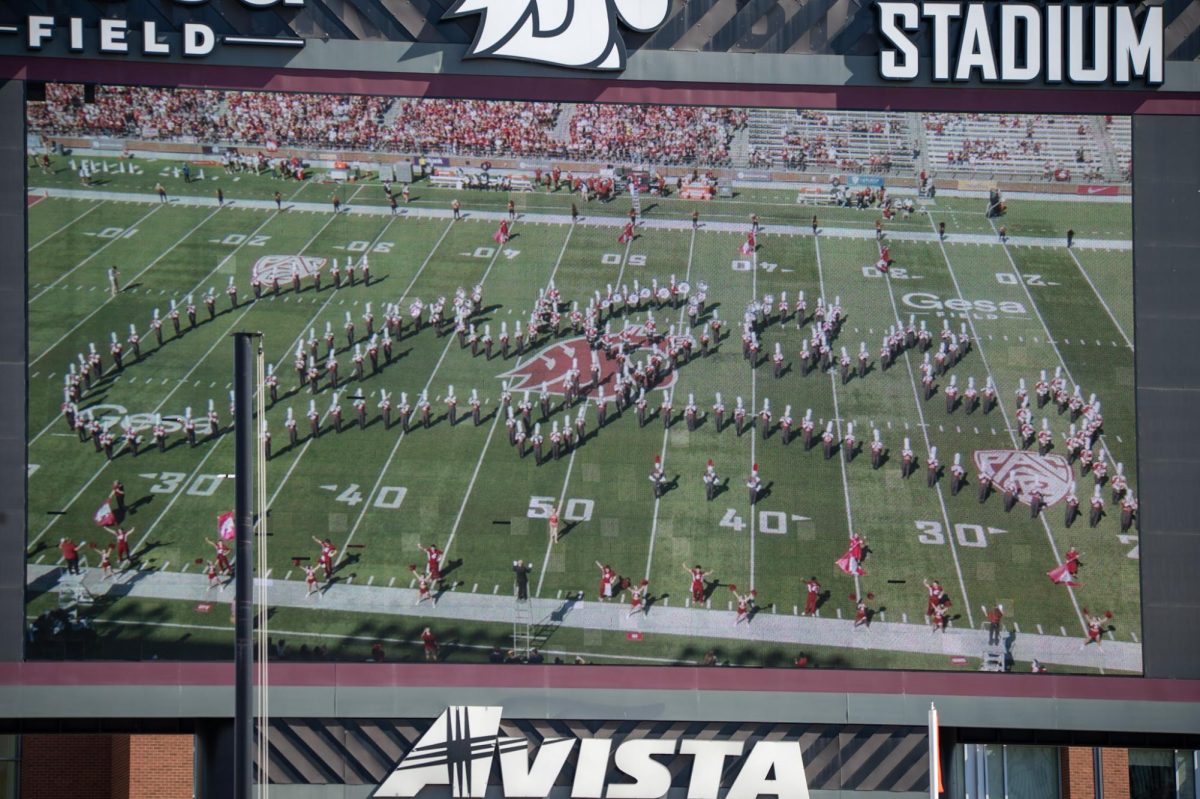 The WSU marching bands spells out Cougars on the field during halftime, Sept. 16. 